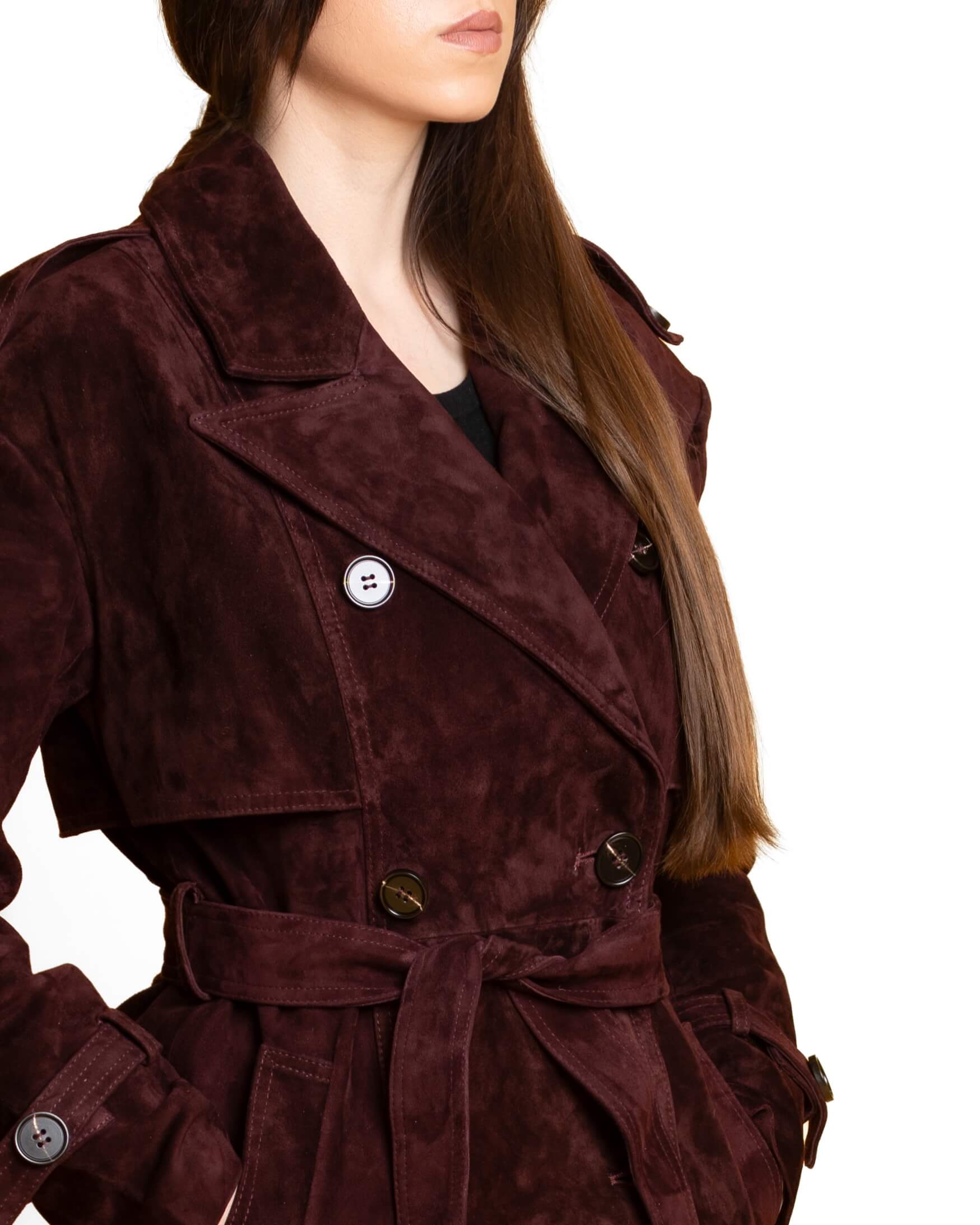 Side profile of a suede coat showing clean tailoring lines and lapel structure