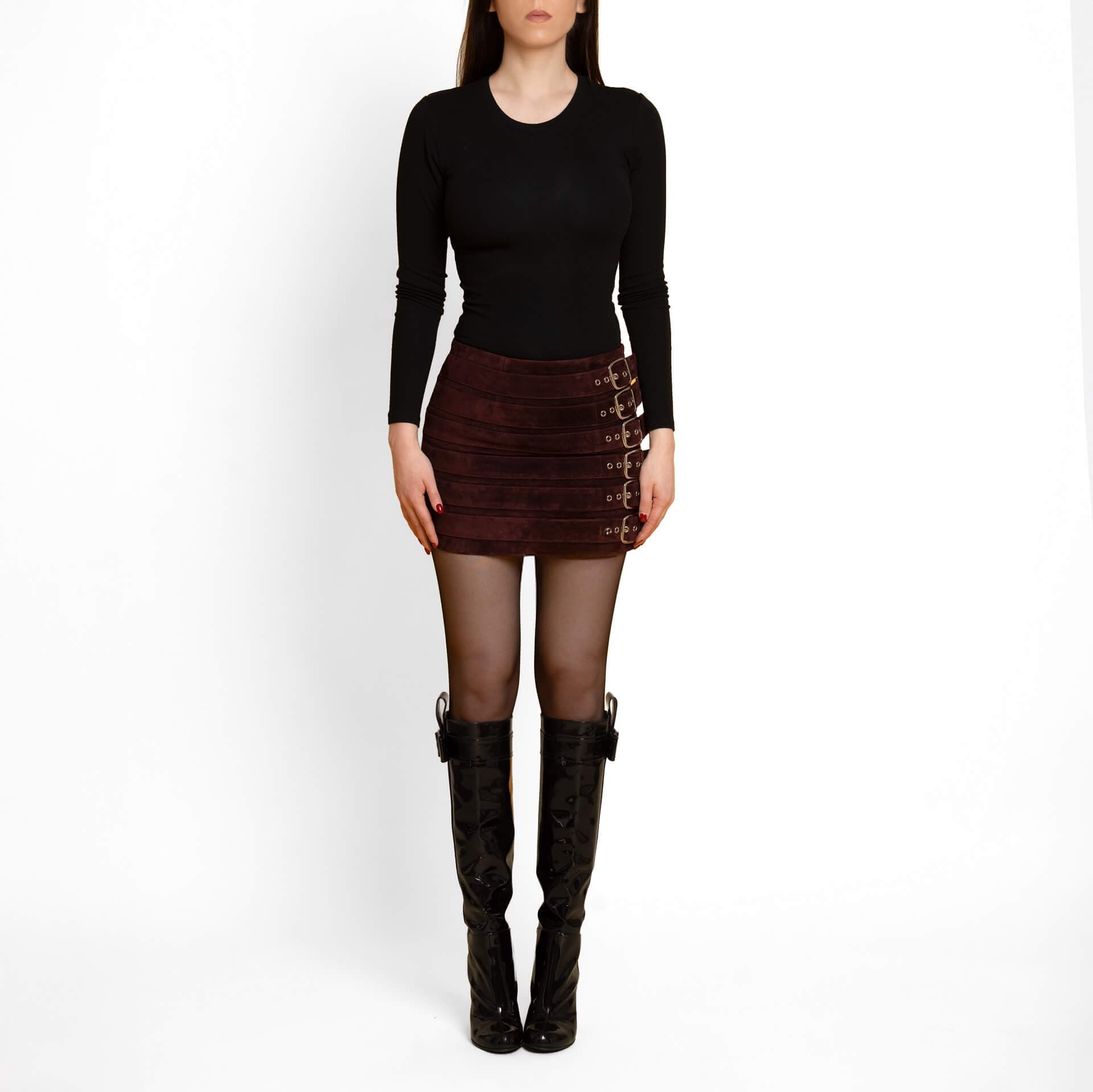 Lustré suede outerwear detail highlighting the softness and drape of genuine suede